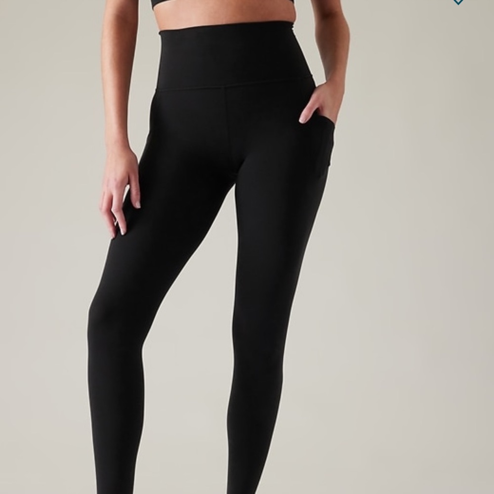 Athleta salutation stash tight